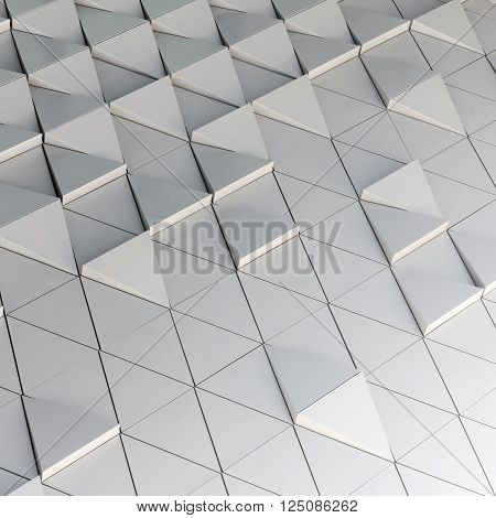 Abstract close-up view of modern aluminum ventilated facade of triangles