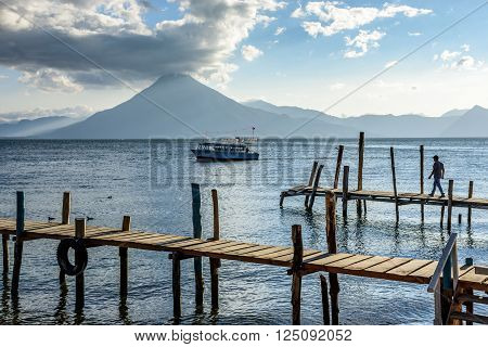 Evening light on Lake Atitlan with San Pedro volcano behind in Guatemalan highlands