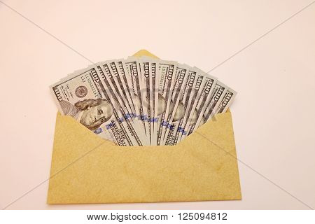 envelope full of hundred dollar bills with new