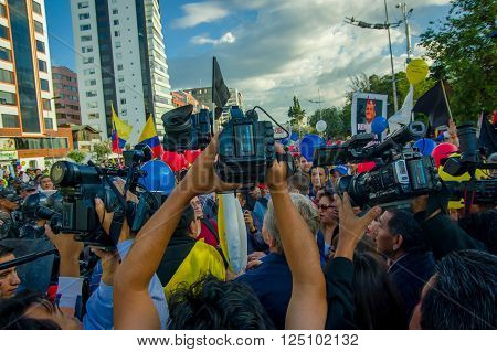 Quito, Ecuador - April 7, 2016: Closeup opposition leader Andres Paez surrounded by people, police and journalists during anti government protests in Shyris Avenue.