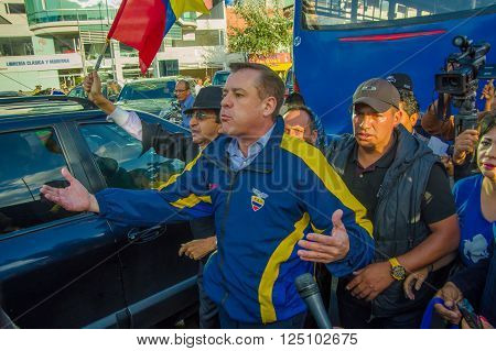 Quito, Ecuador - April 7, 2016: Closeup opposition leader Andres Paez surrounded by people, police and journalists during anti government protests in Shyris Avenue.