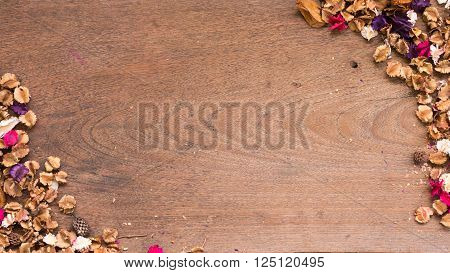 Top view workspace with dried flowers on wooden table background .Free space for your text.