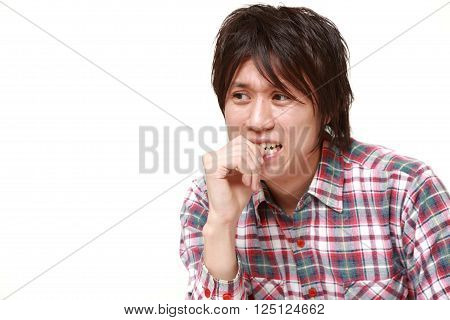 portrait of perplexed man on white background