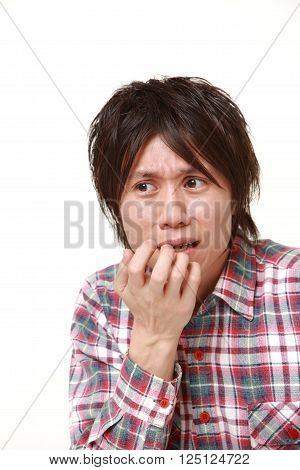 portrait of perplexed man on white background