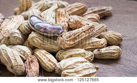 A pile of Boiled Peanuts on wooden table background.