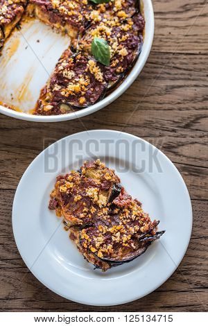 Dish and portion of Parmigiana di melanzane: top view
** Note: Shallow depth of field