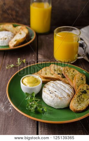 Grilled camembert with toast and juice fresh toasted baquette with herbs and delicious dijon mustard. Beautiful melted cheese.