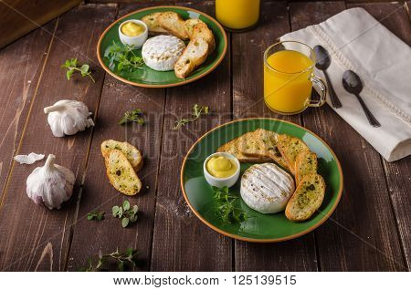Grilled camembert with toast and juice fresh toasted baquette with herbs and delicious dijon mustard. Beautiful melted cheese.