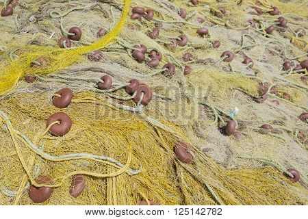 Old dry yellow fishing nets in Greece