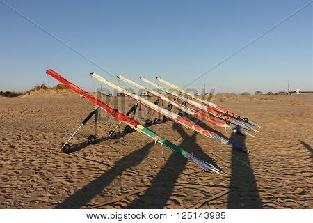 Hang gliders lined up ready for rental