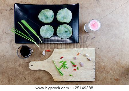 Allium tuberosum. Garlic chives with soy source. Dim sum is chinese cuisine. Dimsum. Flat Lay in Food.