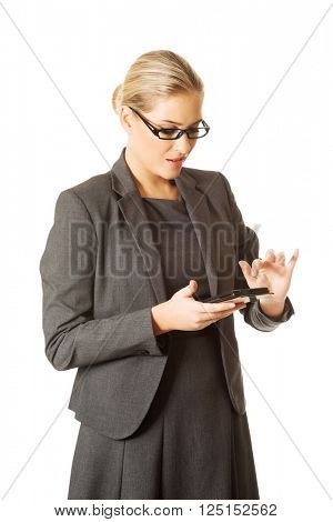 Businesswoman sending a message