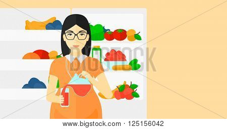 Pregnant woman standing near friedge.