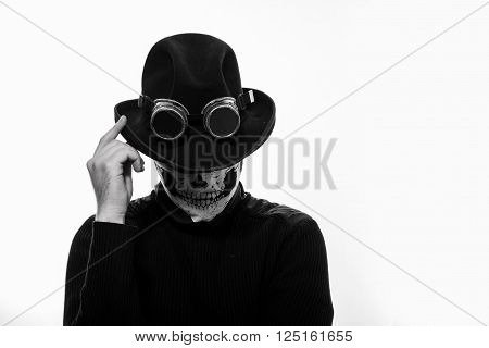 Portrait of a steampunk man in the hat and mask skeleton on white background.