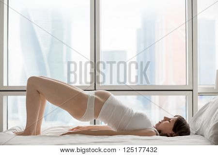 Pregnant Woman Doing Shoulder Bridge Exercise