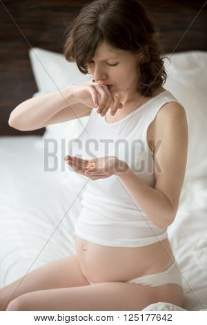 Sick Pregnant Woman Taking Meds