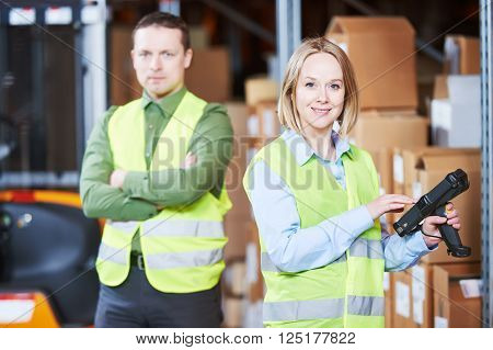 Warehouse Management System. Worker with barcode scanner