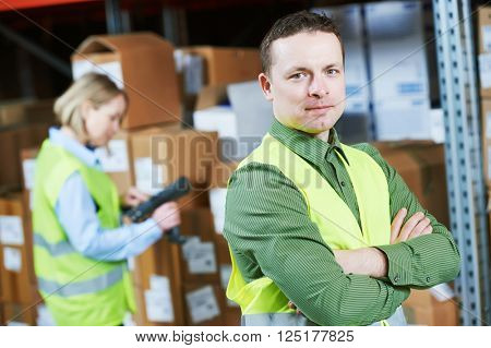 Warehouse Management System. Worker with barcode scanner