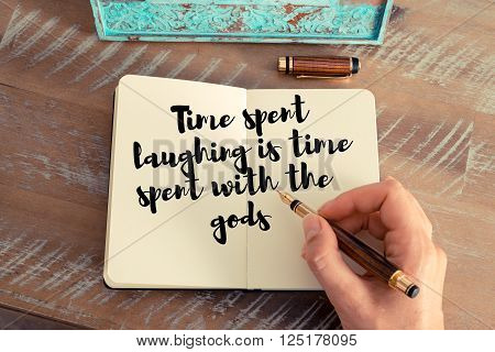Handwritten quote Time spent laughing is time spent with the gods