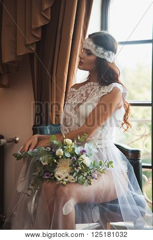 Beautiful sexy girl in boudoir white dress