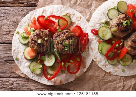 Grilled Meat Balls With Fresh Vegetables On A Flat Bread Closeup. Horizontal Top View