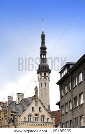 Old city Tallinn Estonia. A old houses and weather vane Old Thomas on the Town hall tower