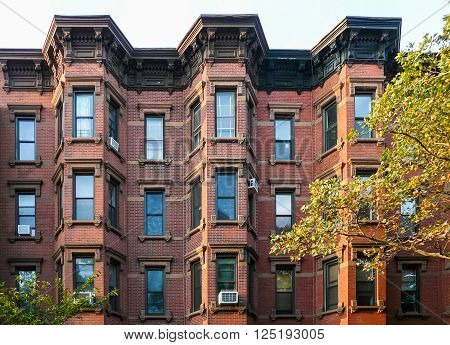 Brooklyn New York - August 16 2014: Front of residential brick house at Kent Street in Greenpoint.
