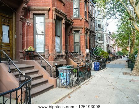Brooklyn New York - August 16 2014: Stairs and portals of residential brick houses at Kent Street in Greenpoint.