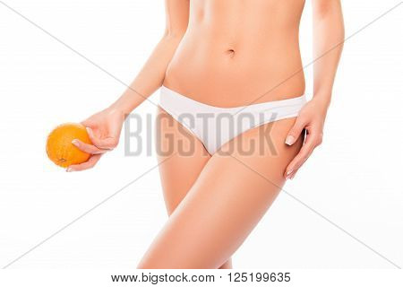 Close Up Photo Of White Woman's Panties And Orange Near  Hip
