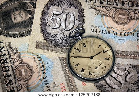 Old hungarian forint money fifty value with old pocket watch
