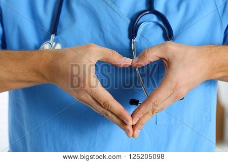 Hands Of Male Medicine Therapeutist Doctor Wearing Blue Uniform