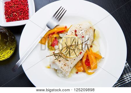 white dish of Fresh black cod with pepper