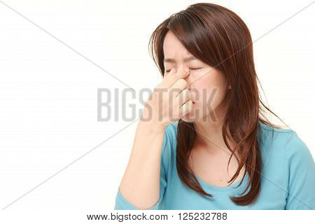 portrait of woman suffers from Asthenopia on white background