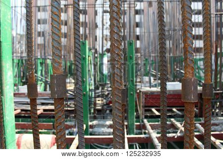 Rebar and steel coupler for wall structure building construction