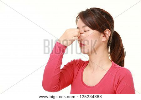 portrait of woman suffers from Asthenopia on white background