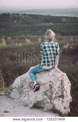 Young woman watching landscape, posing outdoor. Active lifestyle concept. 