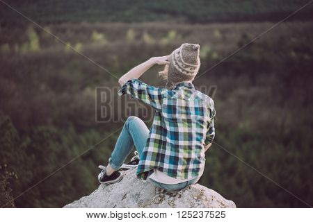 Young woman watching landscape, posing outdoor. Active lifestyle concept. 