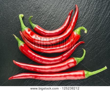 Farm fresh chilli, red chilli, black background, group,random