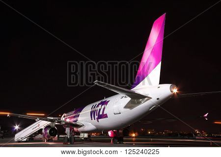 Kiev Ukraine - March 27 2011: Wizz Air Airbus A320 passenger plane at the airport at night