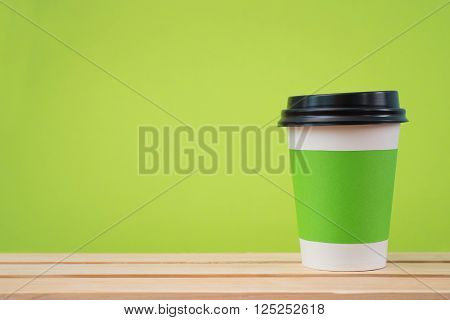 Paper cup with Sleeve on green background