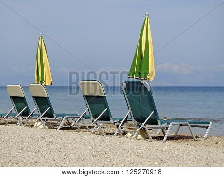 The sunbeds and umbrellas on the beach