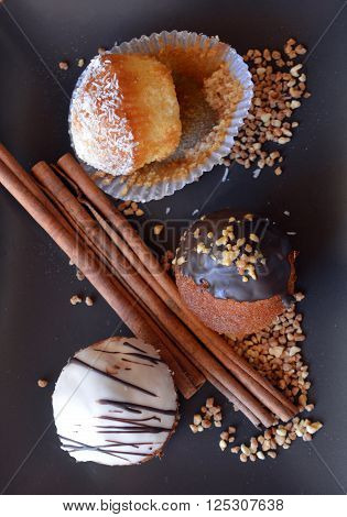Delicious Homemade Vanilla Muffin With Chocolate And Grated Coconut On A Plate