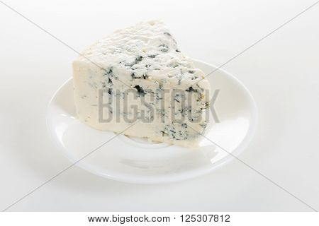 cheese on a white plate on white backgtound