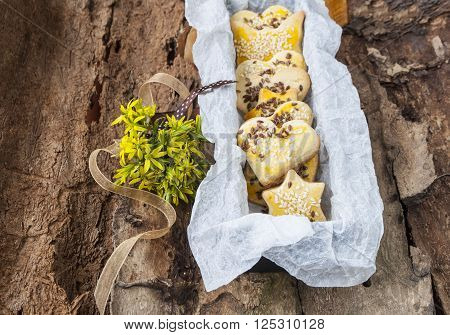 cookies with sesame seeds in a box on the flowers background.
** Note: Soft Focus at 100%, best at smaller sizes