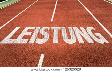 Achievement/Power (in German) written on running track