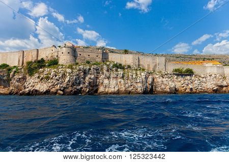 The Walls of Dubrovnik defensive stone walls surrounded Old Town Dubrownik Croatia.