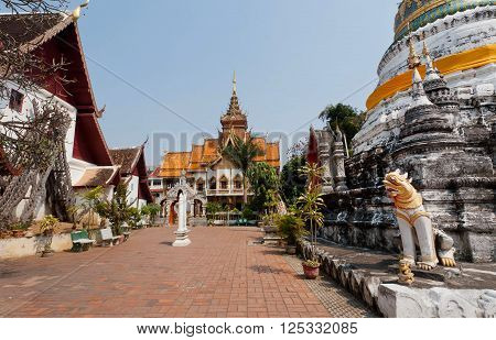 Courtyard and Buddhist stupa structure of Wat Buppharam temple in Chiang Mai Thailand. Historical importance temple was established in 1497 by King Muang Kaew