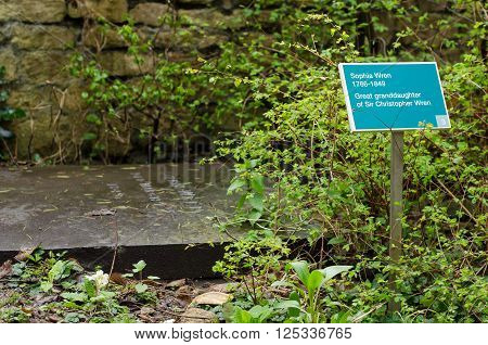 BATH, UK - APRIL 11 2016
Sophia Wren's gravestone. Sign indicating the gravestone of the great granddaughter of the celebrated British architect, in churchyard of Parish Church of Saint John Bathwick, in Bath, Somerset, UK