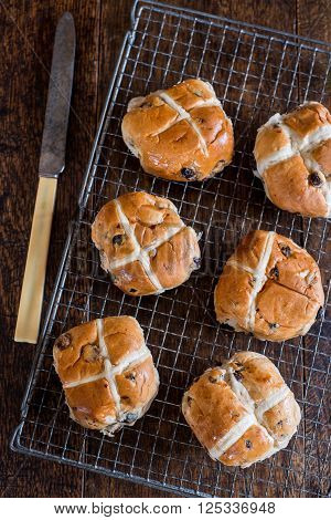 Half Dozen Cross Buns On Rack With Knife