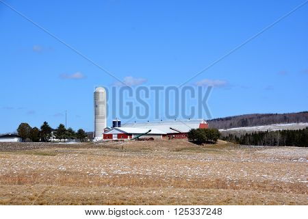 BROMONT QUEBEC CANADA APRIL 10 2016: Early spring farm in country side of Bromont  it is in the Brome-Missisquoi Regional County Municipality.